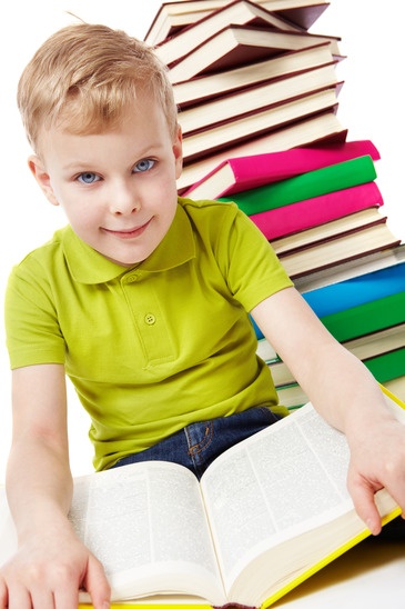 Boy sitting with books