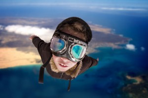 boy dressed as pilot with hat and glasses