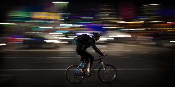 delivery guy with backpack on bike